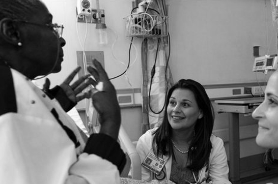 two doctors and patient in a medical room